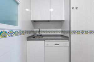 A kitchen or kitchenette at Atico Lujoso