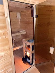 a inside of a sauna in a wooden cabin at Bed and Breakfast Heerenveen Centrum met Privé Sauna en Jacuzzi in Heerenveen