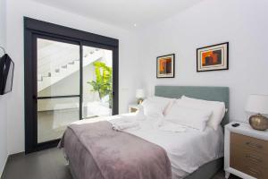 Posteľ alebo postele v izbe v ubytovaní CH Villa Skyline La Marquesa Golf (Ciudad Quesada)