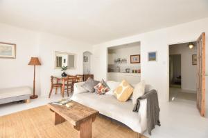 a living room with a couch and a table at Stunning 2 bed with Sea View in Hastings Old Town in Hastings