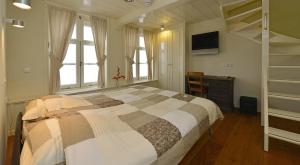 Cama o camas de una habitación en De Witte Olyphant