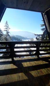 a view from the inside of a viewing window of a mountain at Apartments A Vlasic in Vlasic