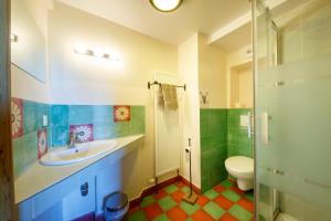 a bathroom with a sink and a toilet at Eco-hôtel et Yourtes du Mercantour in Guillaumes +75 photos