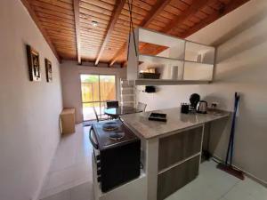 a kitchen with a counter top in a room at CORDOBA AEROPUERTO KEMPES y HOSPITAL ALLENDE ETC in Cordoba