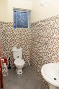 A bathroom at Bamburi Vescon 1 Luxury Apartments
