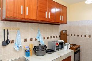 A kitchen or kitchenette at Bamburi Vescon 1 Luxury Apartments