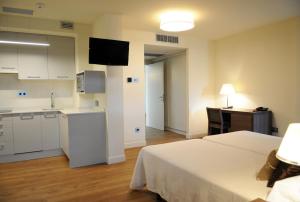 Ένα ή περισσότερα κρεβάτια σε δωμάτιο στο Guiana Rooms - Adults Only