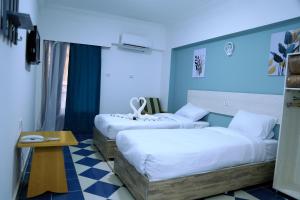 Säng eller sängar i ett rum på Lamera Hotel