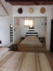 a bedroom with a large bed and a window at Casa GAMA-Playa ORILLA DEL MAR, Beach and Town in Boxol +56 photos