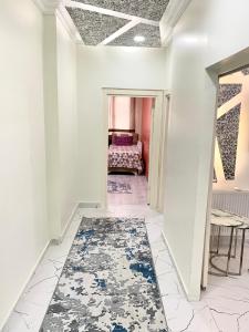 a hallway with a room with a bed and a rug at Luxury home in Beylikduzu in Beylikduzu