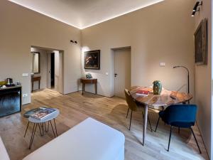 a living room with a table and chairs at FilHome 44 in Catania