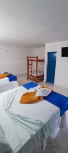 Postel nebo postele na pokoji v ubytování HOTEL BRISAS DE SANTA FE