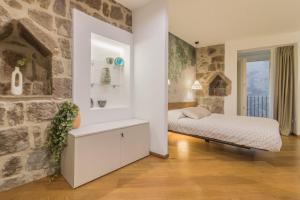 Postel nebo postele na pokoji v ubytování Tuscus Apartments