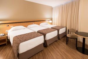 Cama ou camas em um quarto em Hotel Golden Park Internacional Foz & Convenções By Nacional Inn