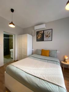 Postel nebo postele na pokoji v ubytování Hostal Orange Vibes