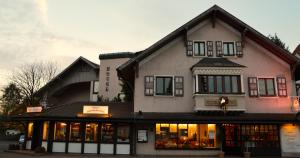 a large building with a store in front of it at Hotel Haus Krone in Bexbach