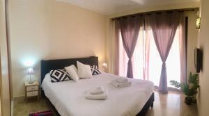 A bed or beds in a room at Dream Apartment in Estepona, Andalusia