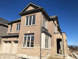 a large brick house with white windows at 537 Veterans Dr Brampton ON L7A 5A6 in Brampton
