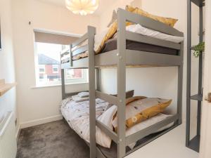 a bedroom with bunk beds in a dorm room at Haven in Lytham St Annes