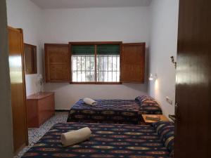 Postel nebo postele na pokoji v ubytování Casa Rural La Colina