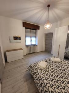a bedroom with a large bed in a room at da Romy Holiday House in Mozzo