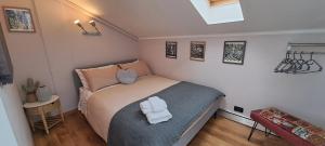 A bed or beds in a room at La Mia Mansardina