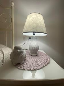 a lamp sitting on a table next to a stuffed animal at APARTAMENTO EN CENTRO PUEBLO in Ribes de Freser
