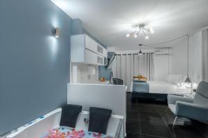 Postel nebo postele na pokoji v ubytování Viktory Boutique Hotel