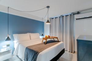 Postel nebo postele na pokoji v ubytování Viktory Boutique Hotel