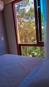 Cama ou camas em um quarto em Apart Vista Azul - hospedagem nas montanhas