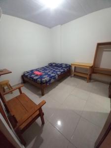 Ein Bett oder Betten in einem Zimmer der Unterkunft Hotel CHAFO