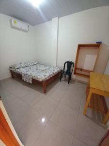 Ein Bett oder Betten in einem Zimmer der Unterkunft Hotel CHAFO