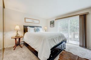 a bedroom with a large bed and a window at Lake Tahoe Retreat in Incline Village