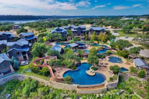 an aerial view of a resort with a water park at Riverbend Cabin #012 in Spicewood