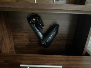 a black iron sitting on top of a wooden table at Luxury suite next to Shangrila and Westin Hotels in Manila