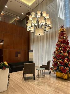 a christmas tree in the lobby of a hotel at Luxury suite next to Shangrila and Westin Hotels in Manila +27 photos