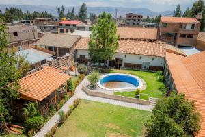 an aerial view of a house with a yard at Llamita Hotel-Huancayo in Huancayo