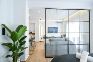 a living room with a large glass wall at Luxury Downtown Apartment C1 in Thessaloniki