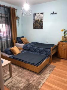 two beds sitting in a room with at Serbian home Smederevo in Smederevo