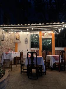 a restaurant with tables and chairs and lights at Casa Diez-59 Guanajuato Capital in Guanajuato