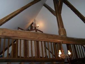 a wooden staircase in a house with a ceiling at Charmante maison de campagne avec vaste parc arboré, cheminée et multiples activités à proximité - FR-1-410-153 in Moulins-le-Carbonnel