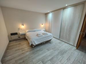 Giường trong phòng chung tại La Terraza Apartment: lujoso, amplio y ubicado en microcentro.