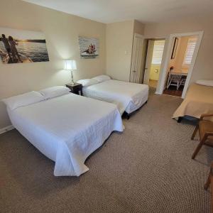 מיטה או מיטות בחדר ב-Early American Motel
