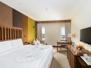 Letto o letti in una camera di Al Falaj Hotel