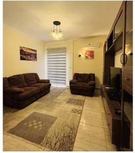 Posezení v ubytování Modern entire apartment in the heart of Sheikh Zayed city