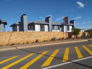 an empty street in front of a brick building at TOP VIEW LUXURY APARTMENT in Centurion