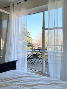 Postel nebo postele na pokoji v ubytování Apartment LoC Friedrichshafen