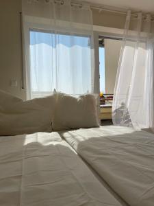 Postel nebo postele na pokoji v ubytování Apartment LoC Friedrichshafen