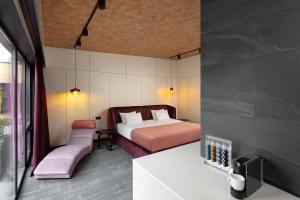 Postel nebo postele na pokoji v ubytování GOOD ZONE Hotel