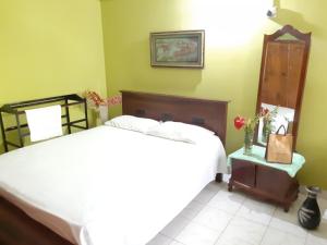 Postel nebo postele na pokoji v ubytování Hellen homestay